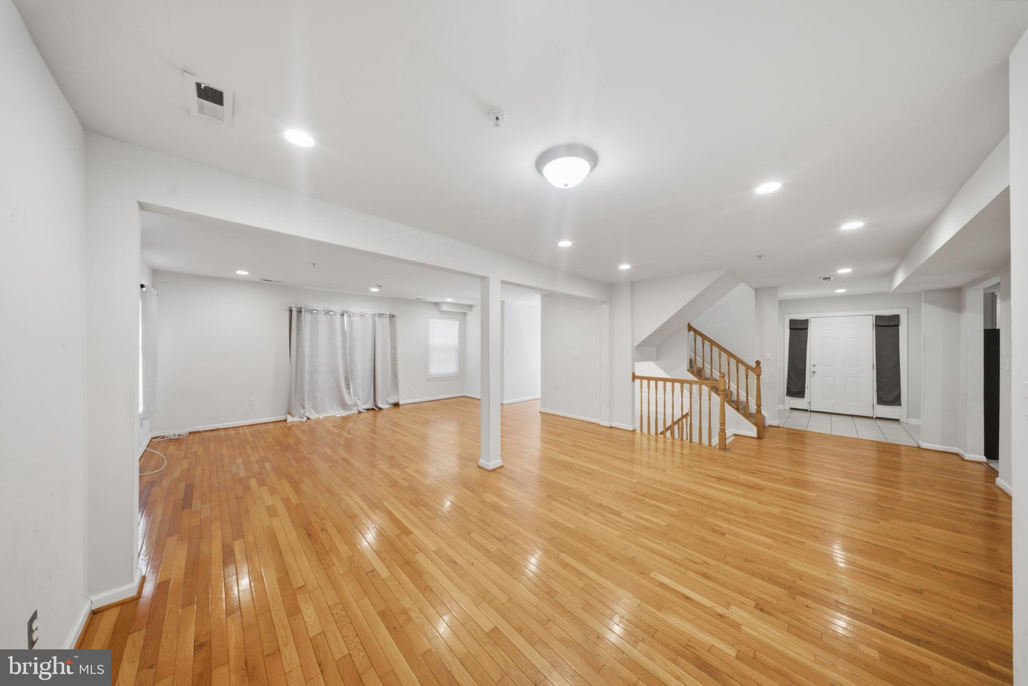 7611 Temple Hill Road Temple Hills, MD 20748 - Photo 5 of 25 a view of an empty room with wooden floor