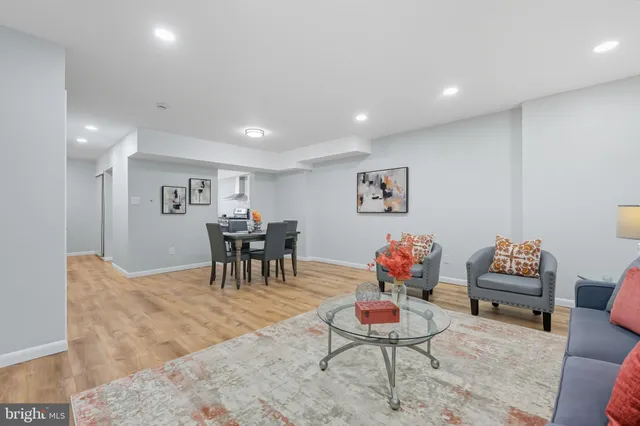 a living room with furniture and a table