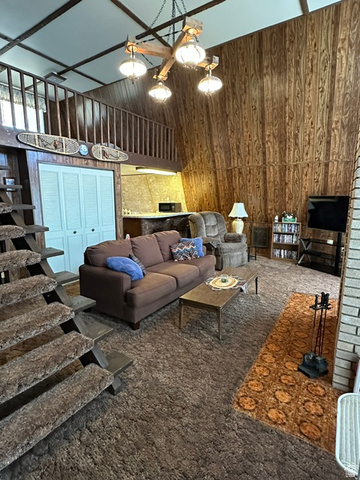 1085 West Elk Road Helper, UT 84526 - Photo 7 of 40 Vaulted ceilings and wood-paneled walls define this interior space