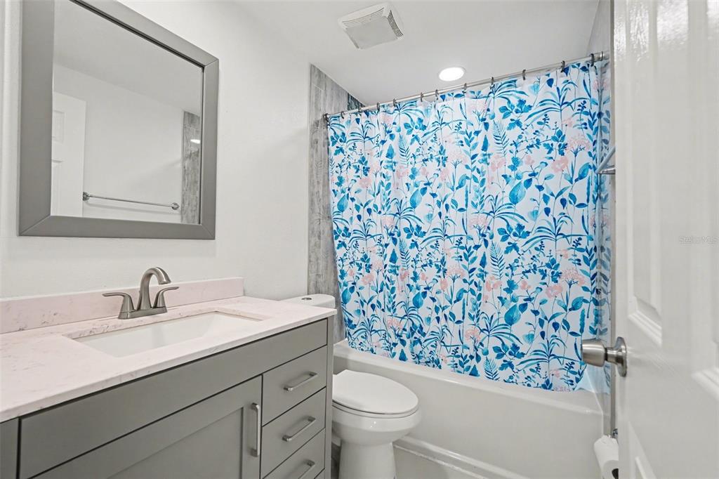 11828 Bingham Drive Port Richey, FL 34668 - Photo 23 of 32 a bathroom with a sink toilet and shower