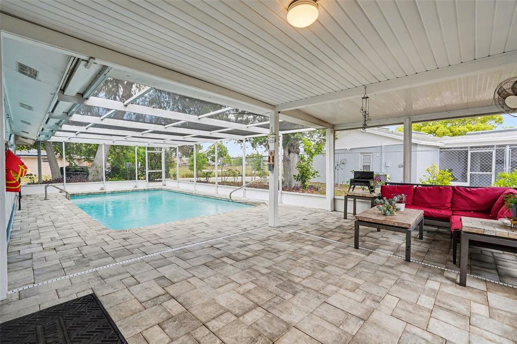 11828 Bingham Drive Port Richey, FL 34668 - Photo 24 of 32 a view of a swimming pool with a patio