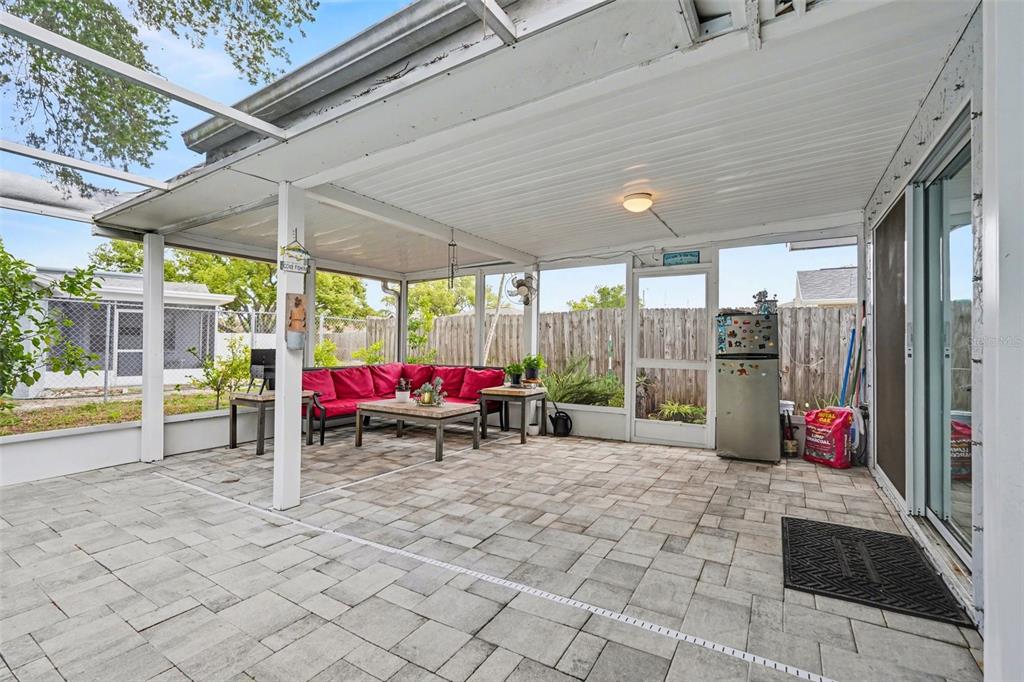11828 Bingham Drive Port Richey, FL 34668 - Photo 25 of 32 a view of a chairs and table in patio with a patio