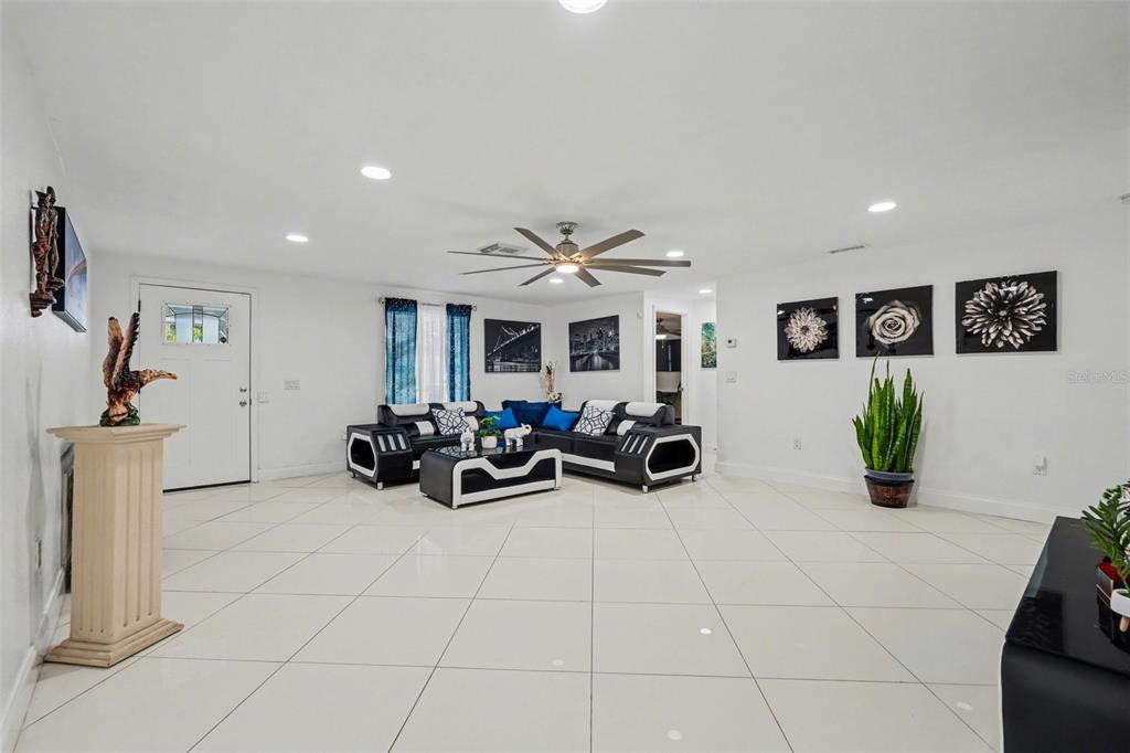 11828 Bingham Drive Port Richey, FL 34668 - Photo 6 of 32 a view of a livingroom with furniture and a chandelier