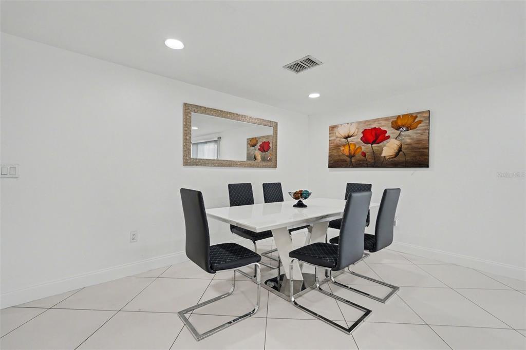 11828 Bingham Drive Port Richey, FL 34668 - Photo 10 of 32 a view of a dining room with furniture
