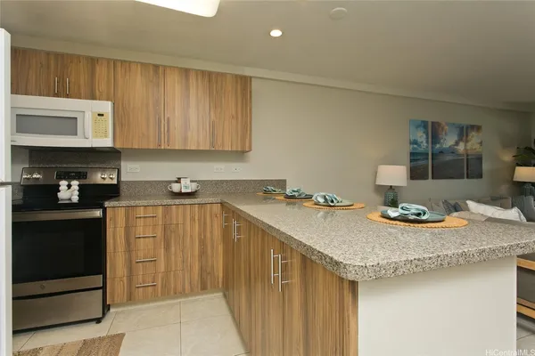 a kitchen with a sink cabinets and stainless steel appliances