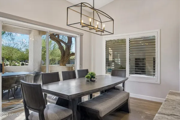 a view of a dining room with furniture window and outside view