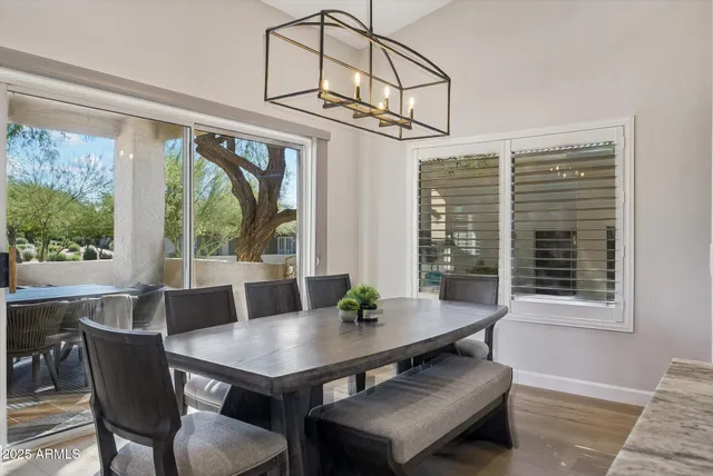 a view of a dining room with furniture window and outside view