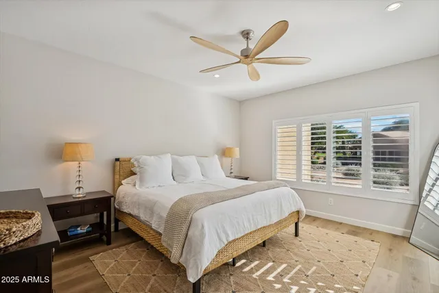 a bedroom with a bed and a window