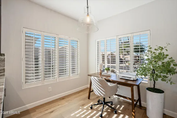 a dining room with furniture and window