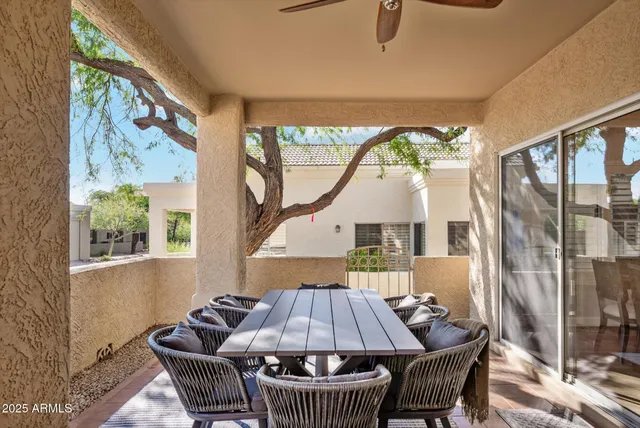 a table and chairs in a balcony