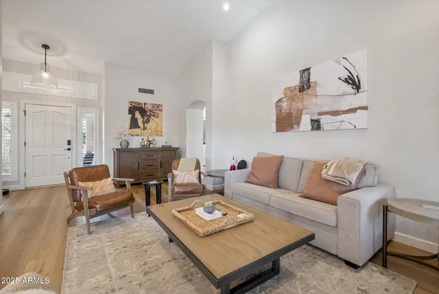 a living room with furniture and a table