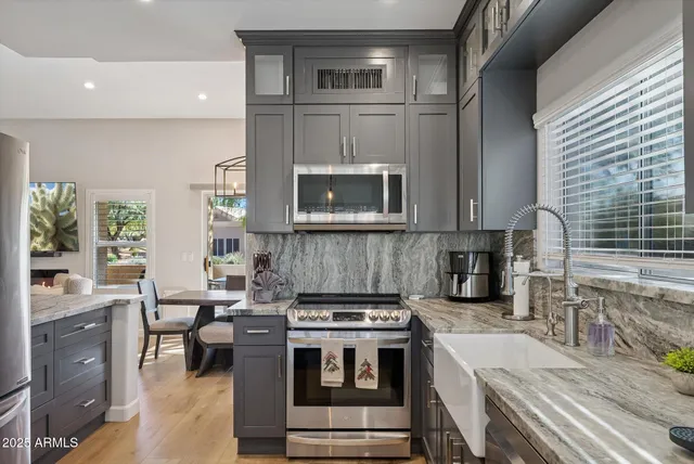 a kitchen with a stove and a sink