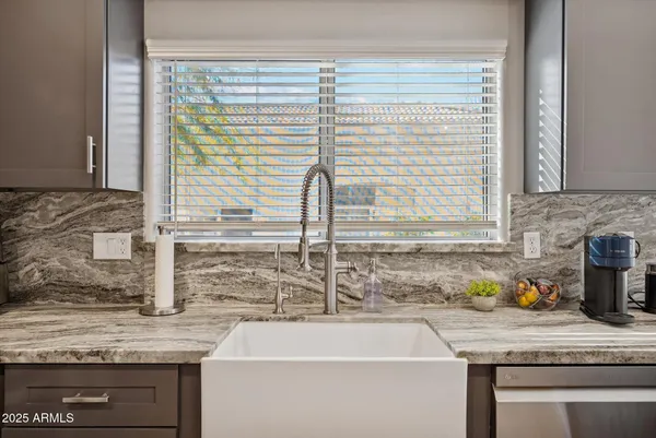 a kitchen with a sink and a window