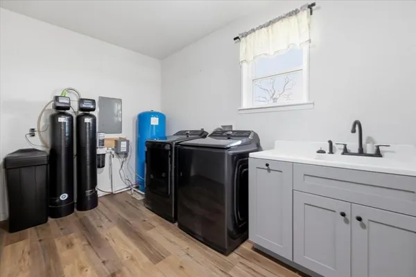 a kitchen with a sink and refrigerator