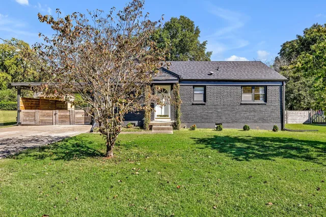 a brick house with a yard