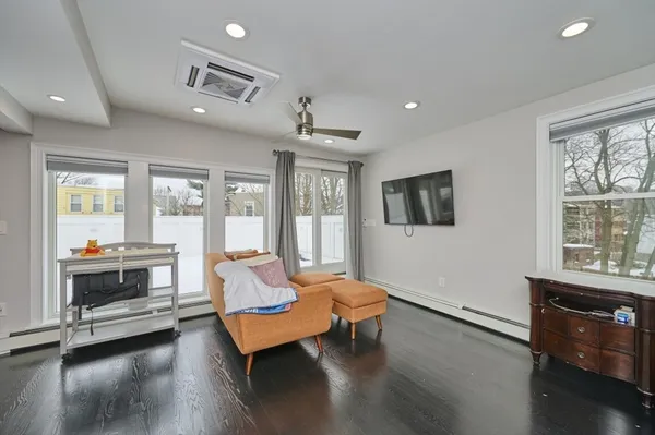 a living room with furniture and a large window