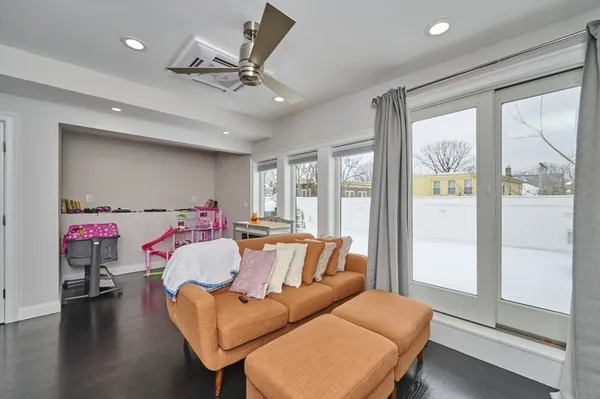 a bedroom with furniture and a flat screen tv