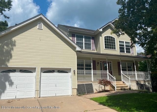 213 Topside Road Manahawkin, NJ 08050 - Photo 1 of 16 a front view of a house with a yard