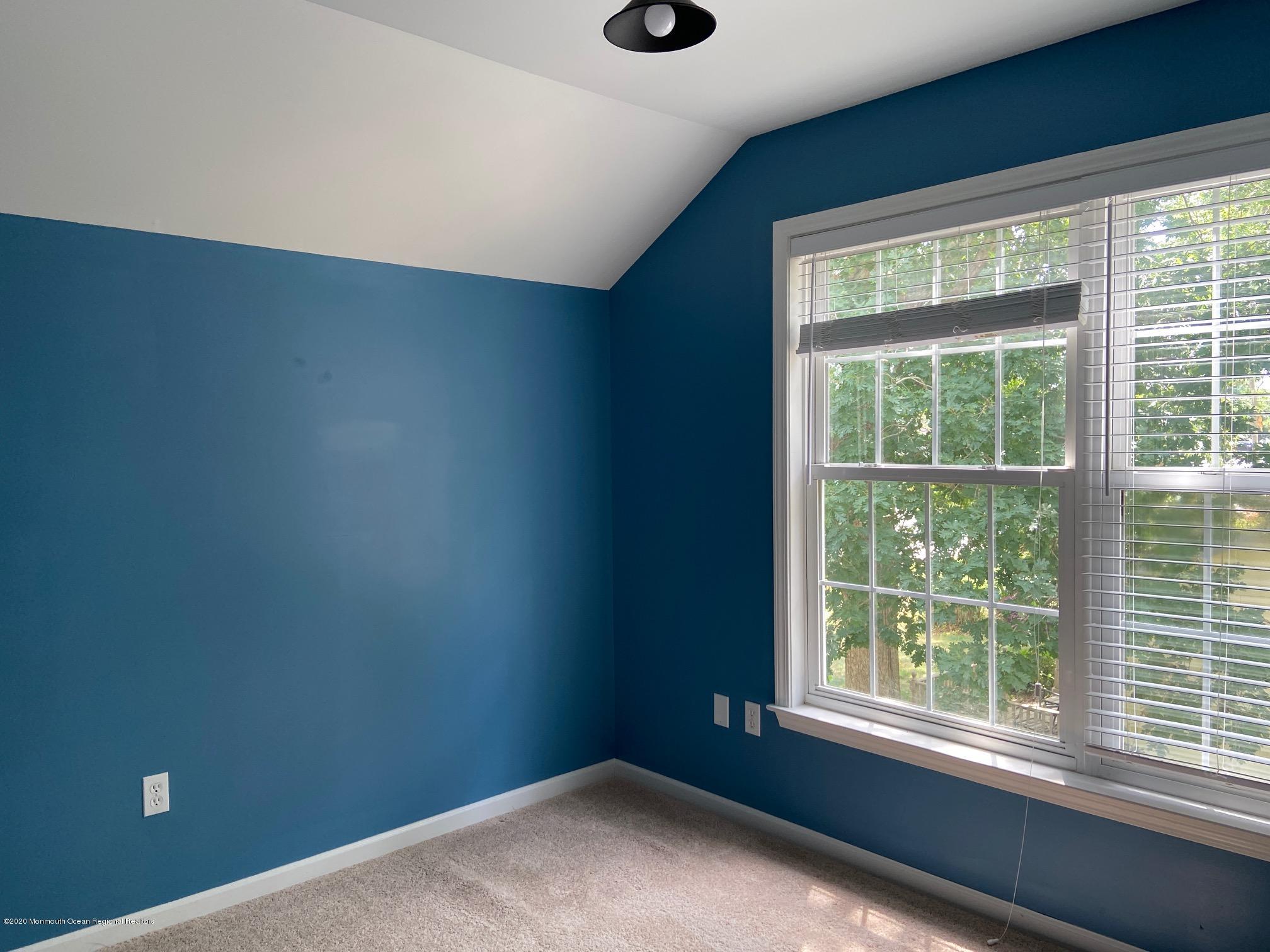213 Topside Road Manahawkin, NJ 08050 - Photo 12 of 16 a view of an empty room with a window