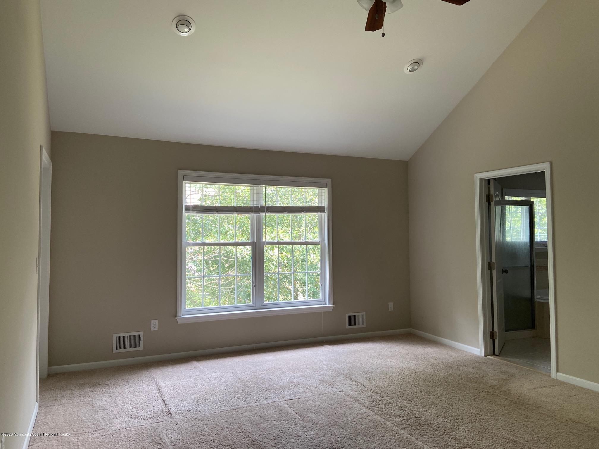 213 Topside Road Manahawkin, NJ 08050 - Photo 13 of 16 an empty room with windows