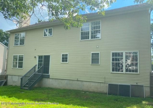 213 Topside Road Manahawkin, NJ 08050 - Photo 15 of 16 a view of a house with a yard