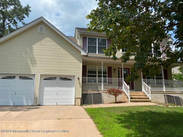 213 Topside Road Manahawkin, NJ 08050 - Photo 2 of 16 a view of house with backyard and a garden