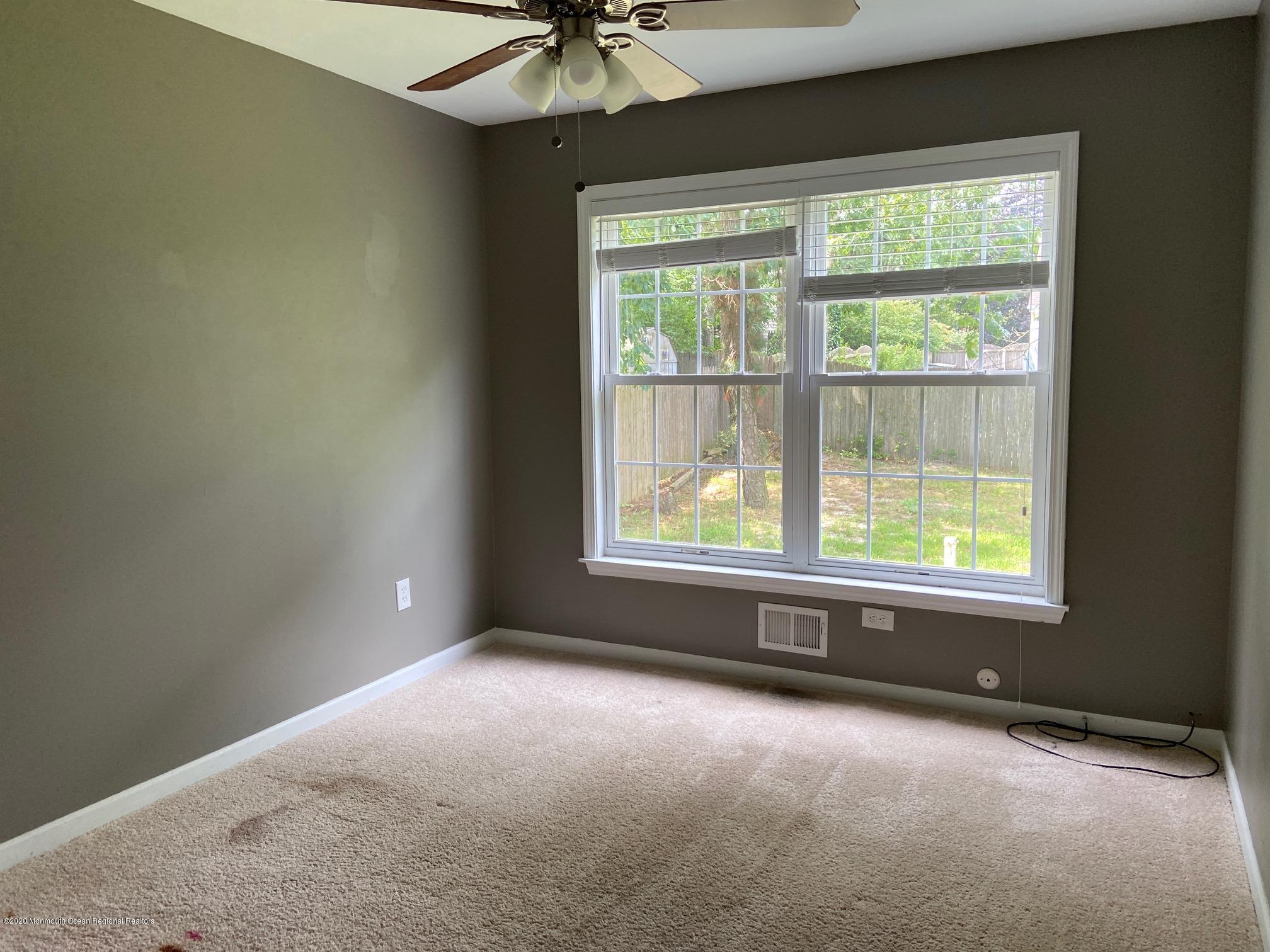 213 Topside Road Manahawkin, NJ 08050 - Photo 7 of 16 an empty room with a window