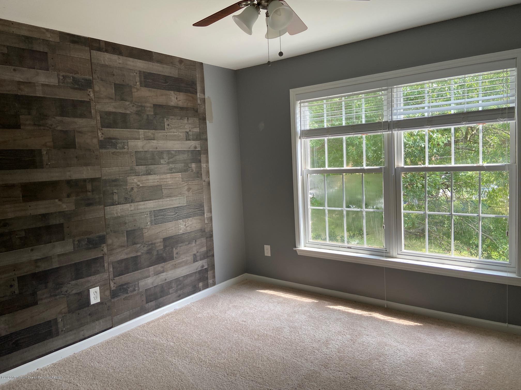 213 Topside Road Manahawkin, NJ 08050 - Photo 8 of 16 a view of an empty room with a window