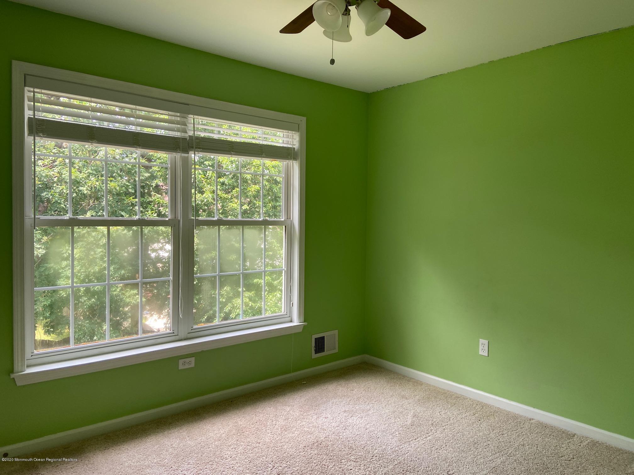 213 Topside Road Manahawkin, NJ 08050 - Photo 10 of 16 a view of empty room with window and ceiling fan