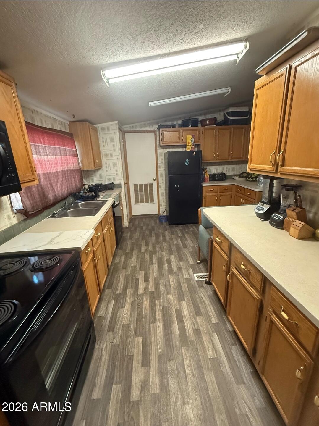 2625 Saddle Vista Road Tonopah, AZ 85354 - Photo 8 of 19 a kitchen with a stove and a sink