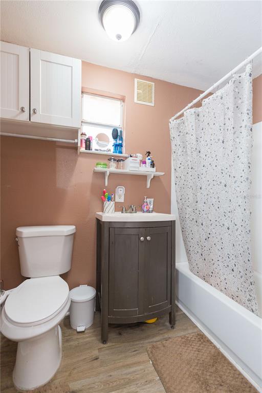 2322 West Cherry Street Tampa, FL 33607 - Photo 9 of 36 a bathroom with a toilet sink and mirror