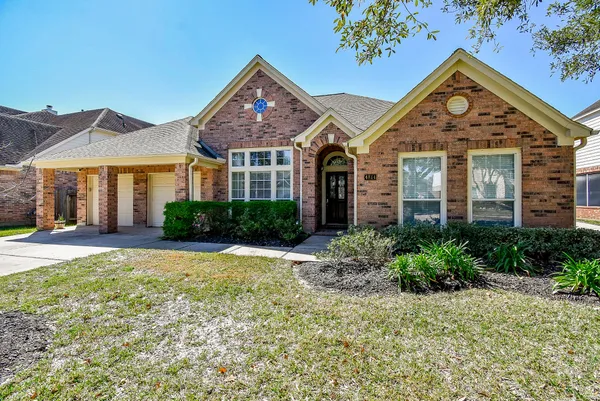 front view of a house with a yard
