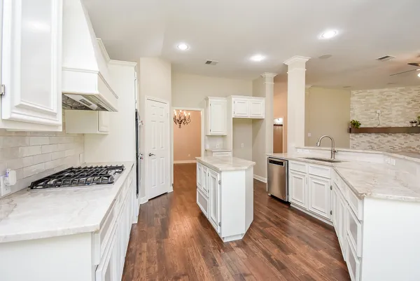 a kitchen with a sink and a refrigerator