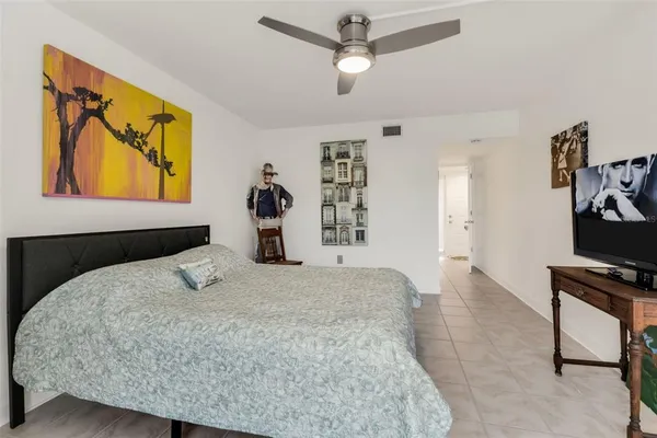 a bedroom with a bed and dresser