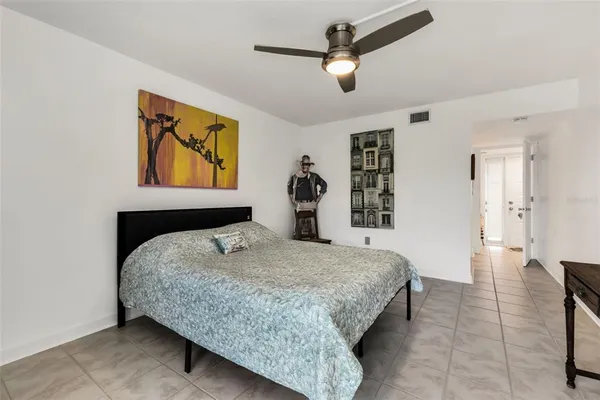 a bedroom with a bed and dresser