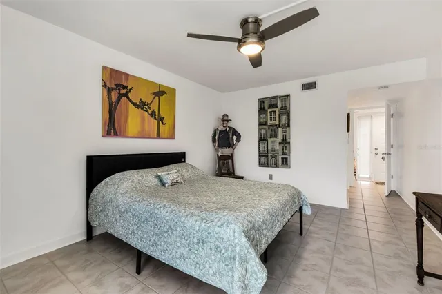 a bedroom with a bed and dresser