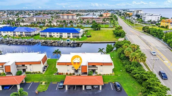 an aerial view of a house with a swimming pool yard and outdoor seating