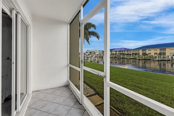 a view of balcony with yard