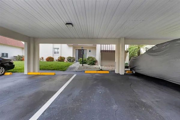 a view of a house with backyard and porch