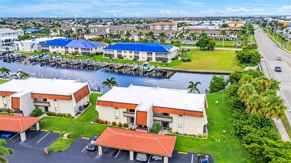an aerial view of a house with a swimming pool yard and outdoor seating
