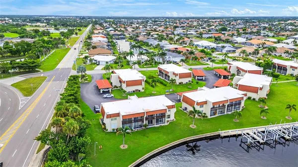 an aerial view of residential houses with outdoor space