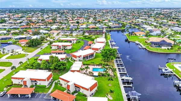 an aerial view of residential houses with outdoor space