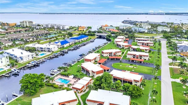an aerial view of a houses with a swimming pool