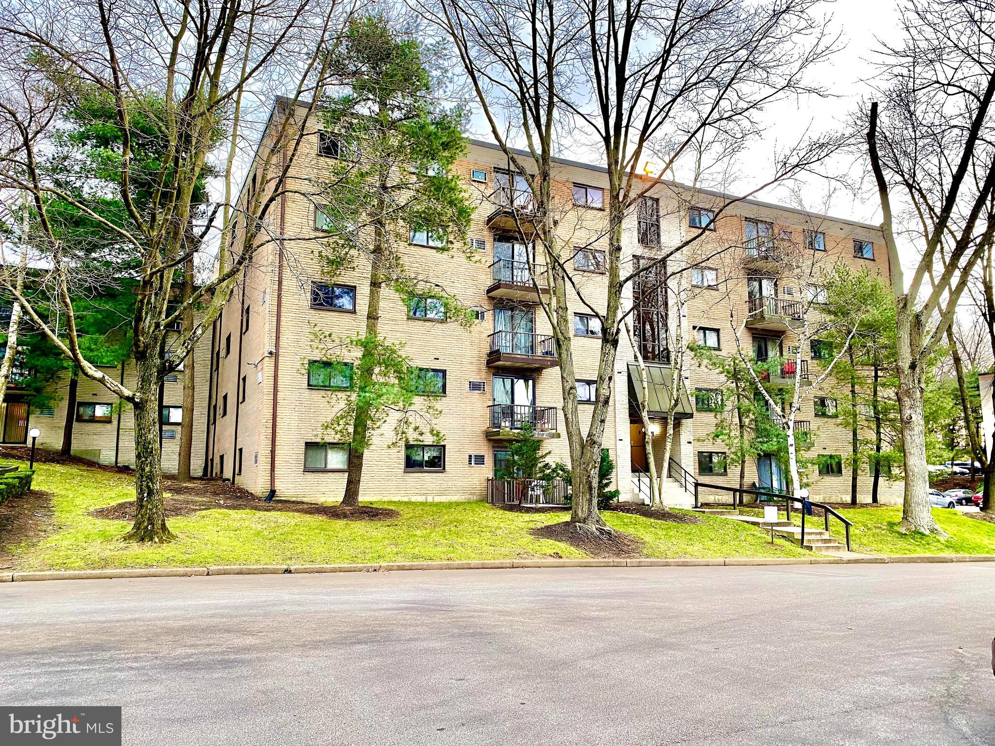400 Glendale Road Havertown, PA 19083 - Photo 13 of 24 a view of a house with a swimming pool and large trees