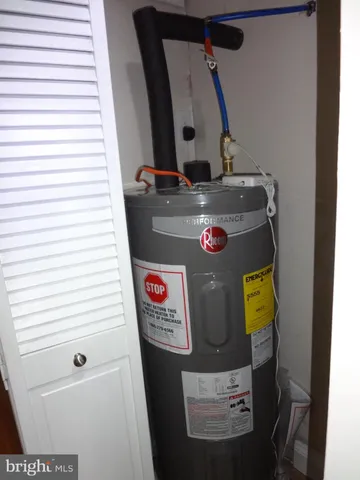 a view of a kitchen with a sink and a refrigerator