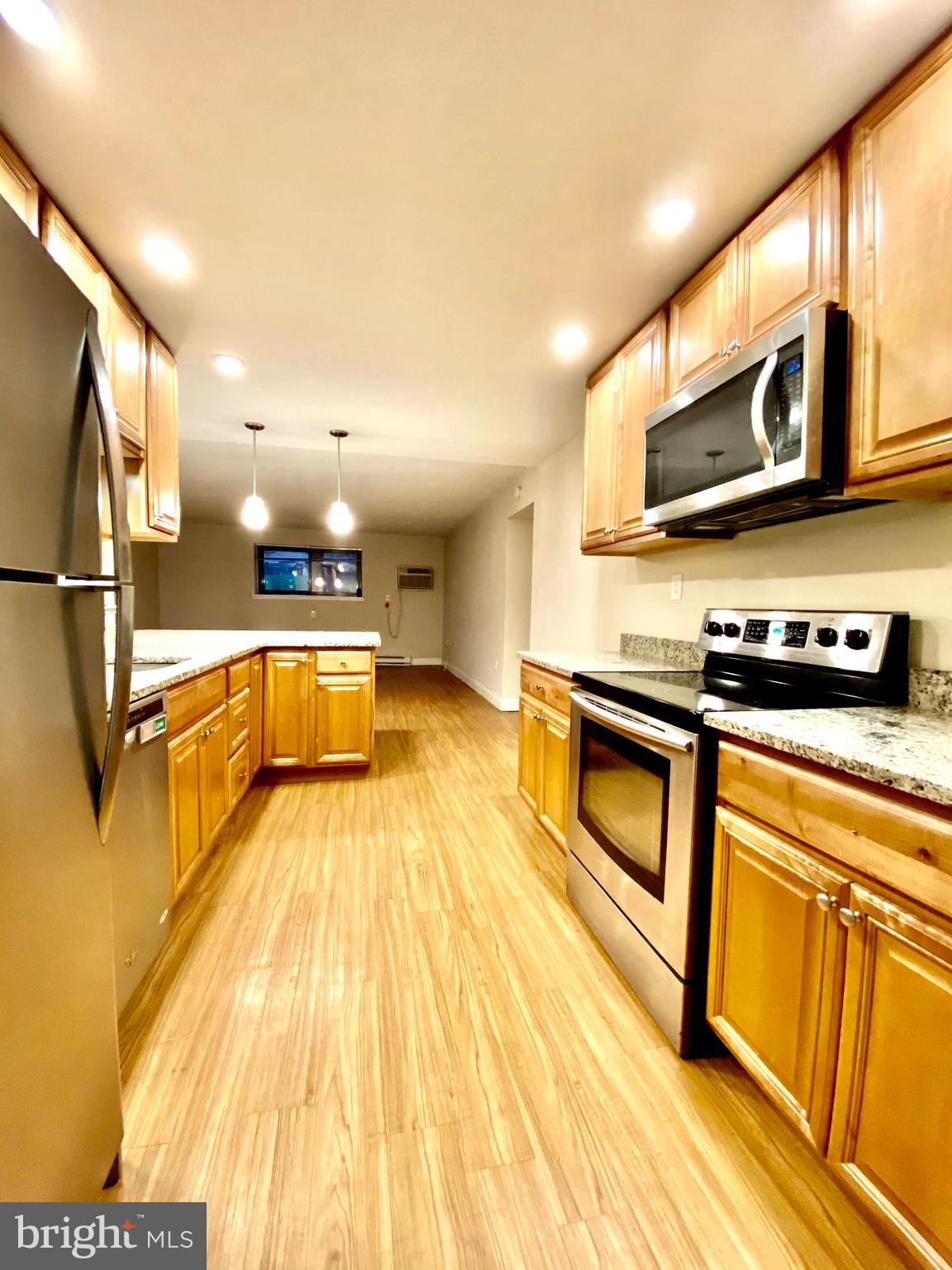 400 Glendale Road Havertown, PA 19083 - Photo 5 of 24 a kitchen with stainless steel appliances granite countertop a sink a stove and cabinets