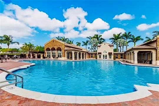 3380 Northeast 9th Street, Unit 203 Homestead, FL 33033 - Photo 3 of 21 a view of swimming pool with outdoor seating