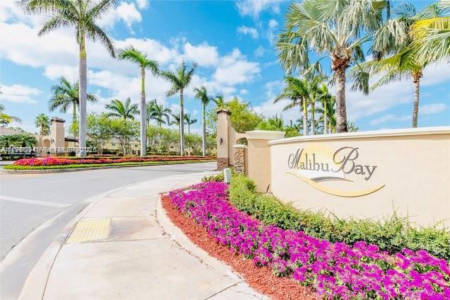 3380 Northeast 9th Street, Unit 203 Homestead, FL 33033 - Photo 4 of 21 a sign on the side of a building