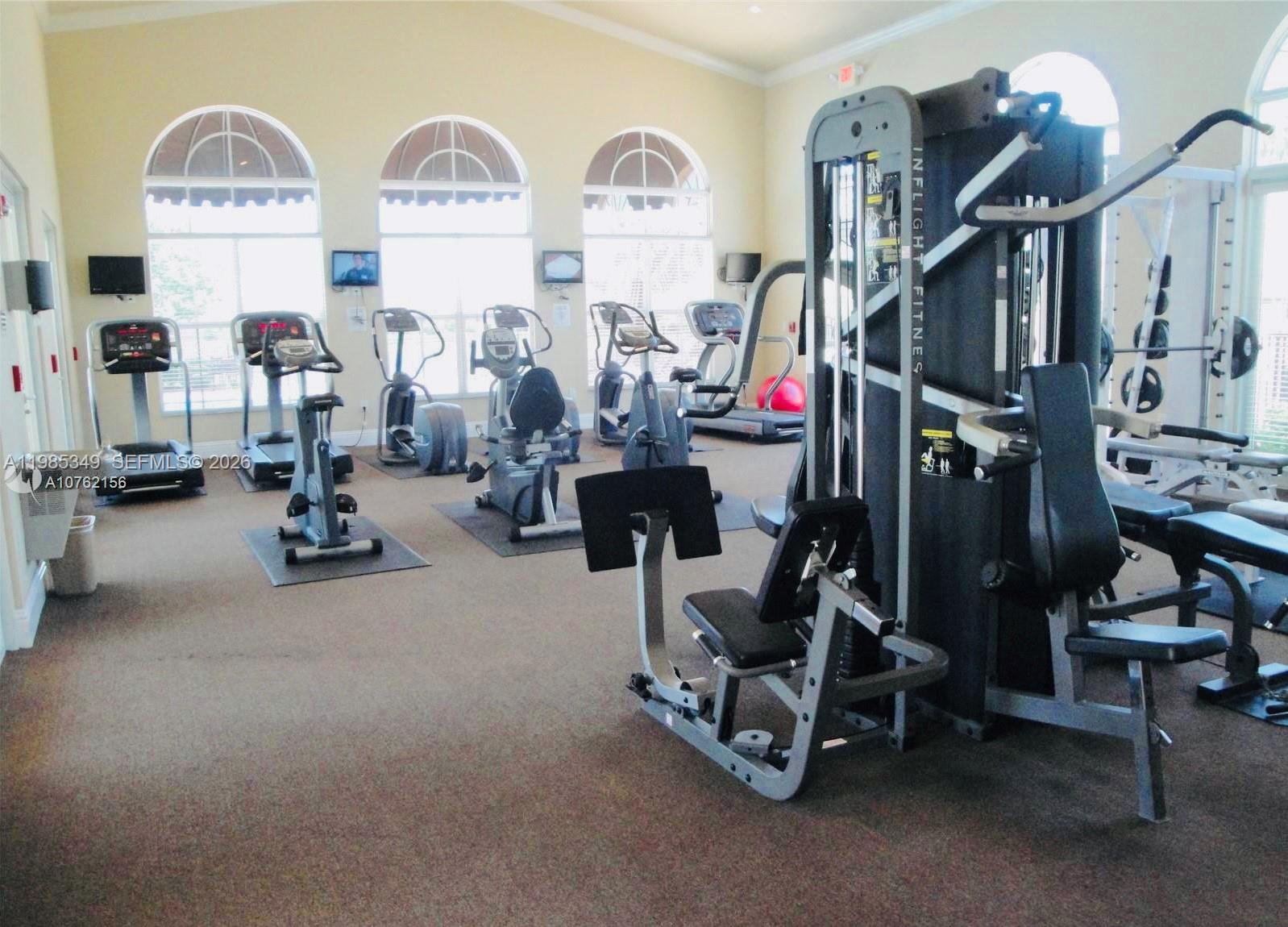 3380 Northeast 9th Street, Unit 203 Homestead, FL 33033 - Photo 5 of 21 a view of a room with gym equipment