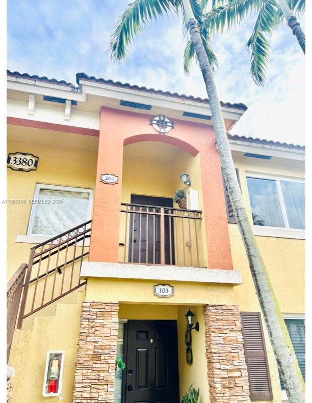 3380 Northeast 9th Street, Unit 203 Homestead, FL 33033 - Photo 6 of 21 a view of entryway with a front door